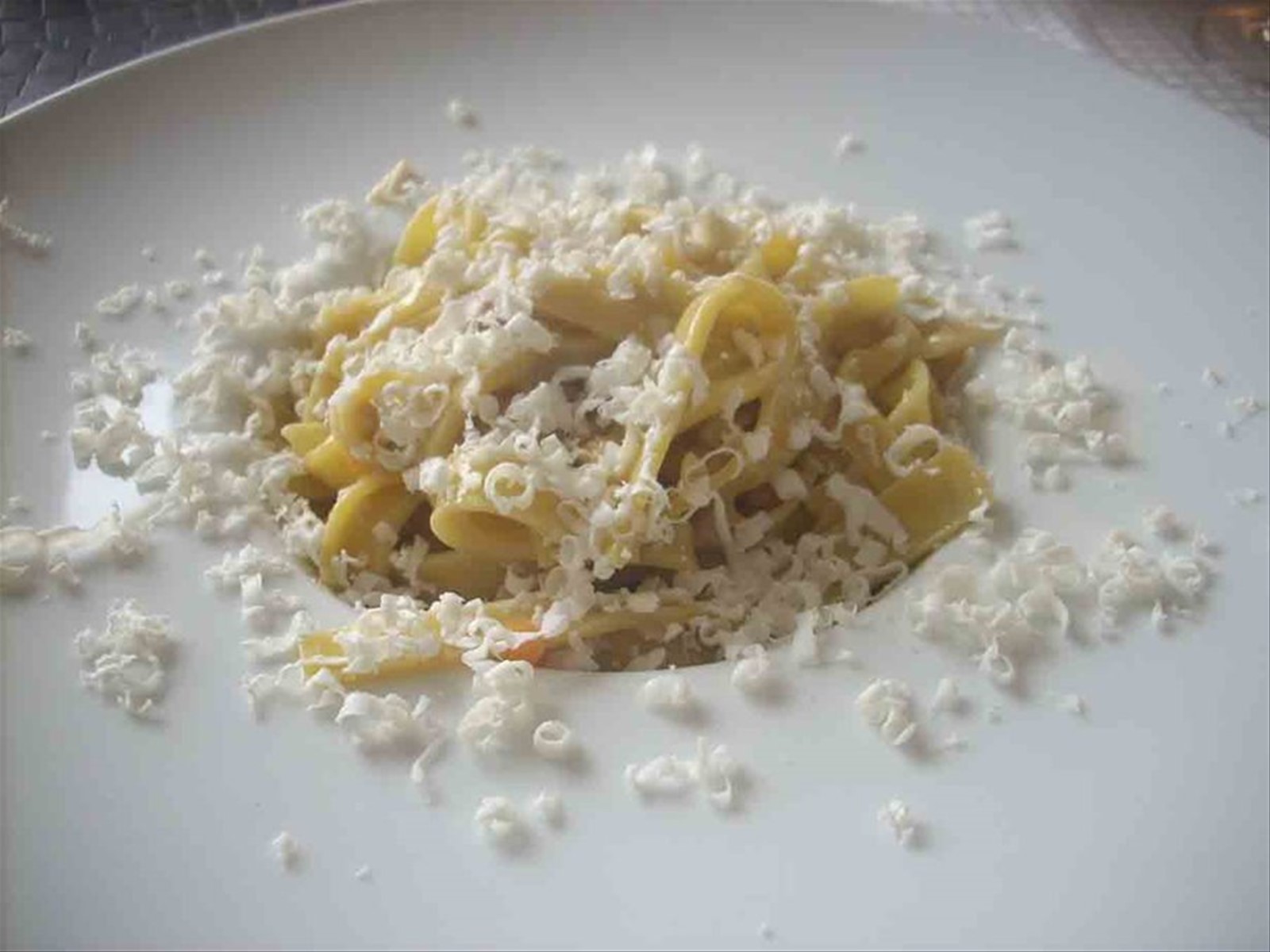 Malfatti caserecci con ragù di coniglio, olive taggiasche e ricotta stagionata